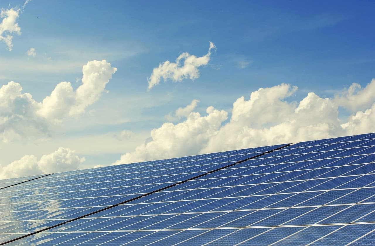 Aerial view of a utility-scale solar farm monitored by STD.iO energy management software